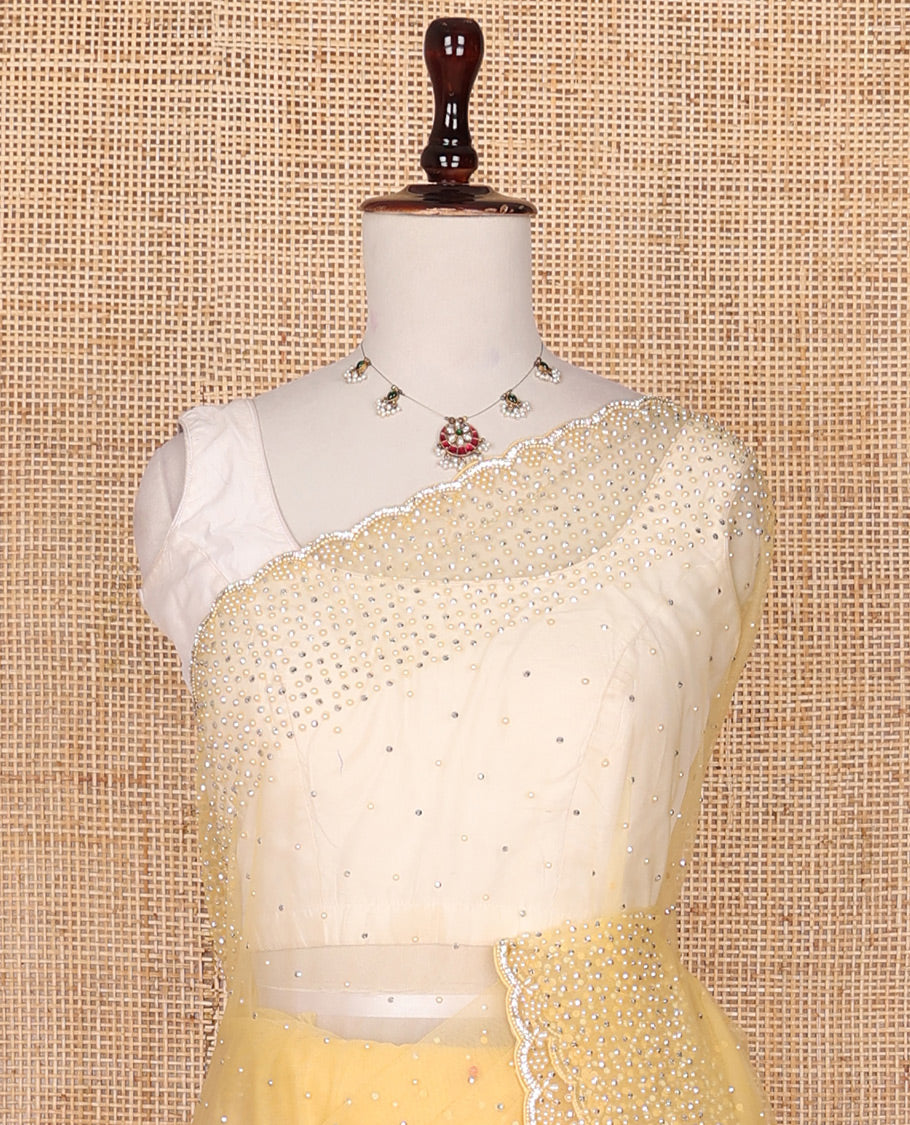 Pale yellow crystal stone & pearl beads embroidered designer saree with scallop embroidered border