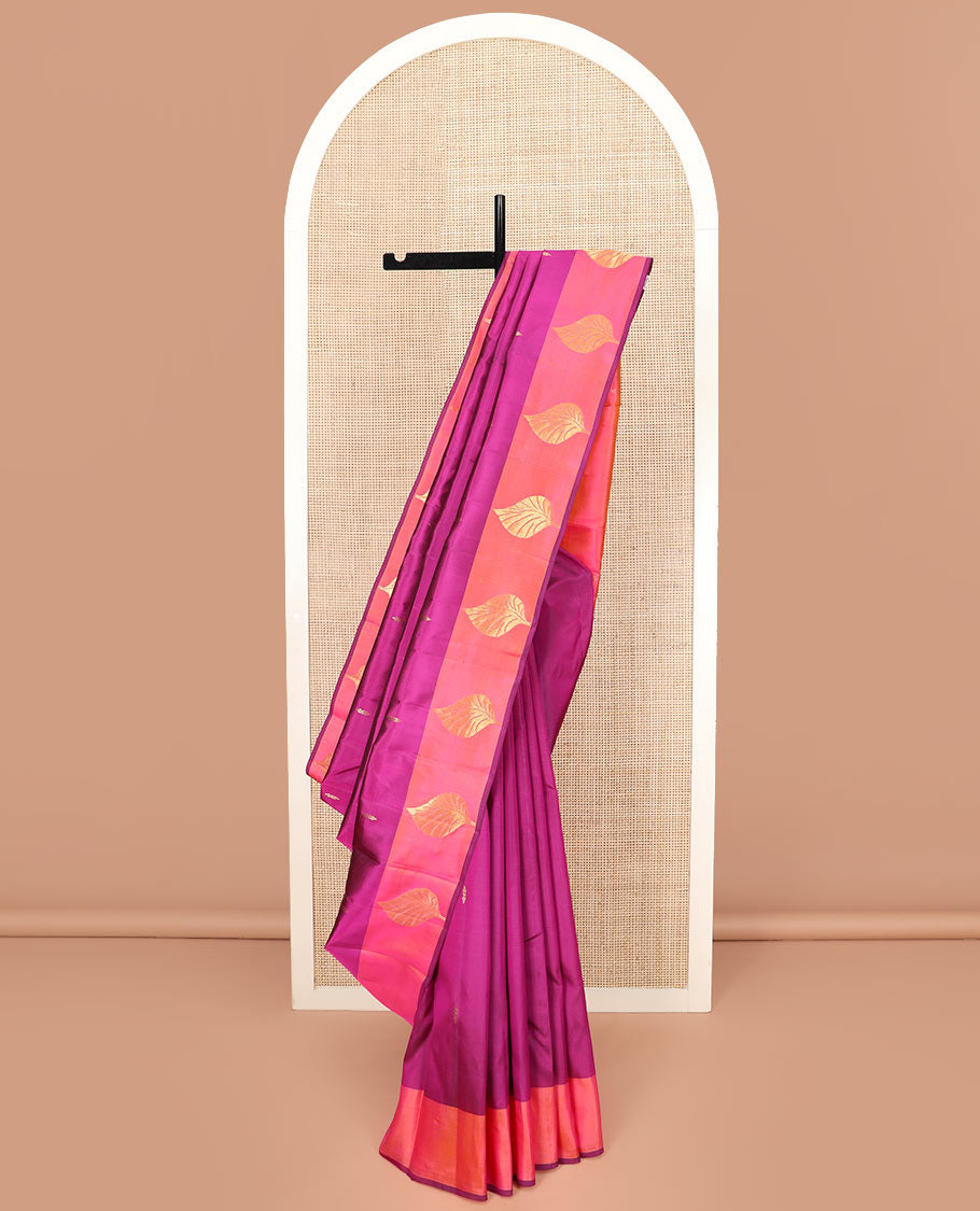 Purple Kanchipuram Silk Saree Featuring All-Over Zari Buttas, Highlighted by a Contrast Border with Leaf Zari Buttas, and a Pallu Adorned with Floral Motifs, Paired with a Subtle Contrast Plain Blouse