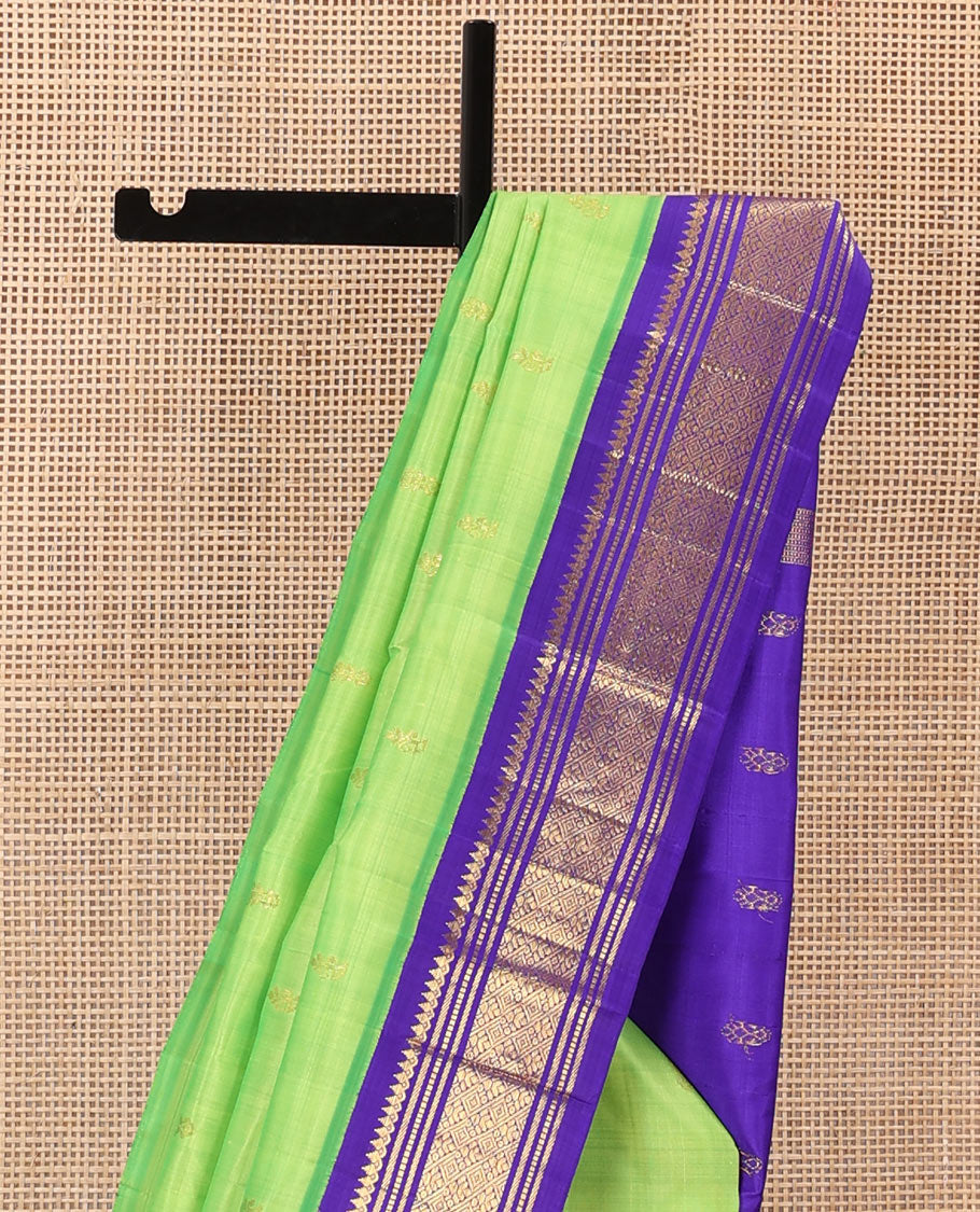 Green zari buttas Kanchipuram silk saree, contrast one-sided korvai zari border of thilakam mokku, banaras, muthu, and jaal, and zari design pallu