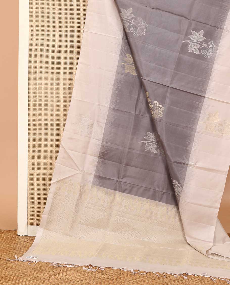 Grey floral buttas soft silk saree, contrast border of floral buttas, and jaal pallu