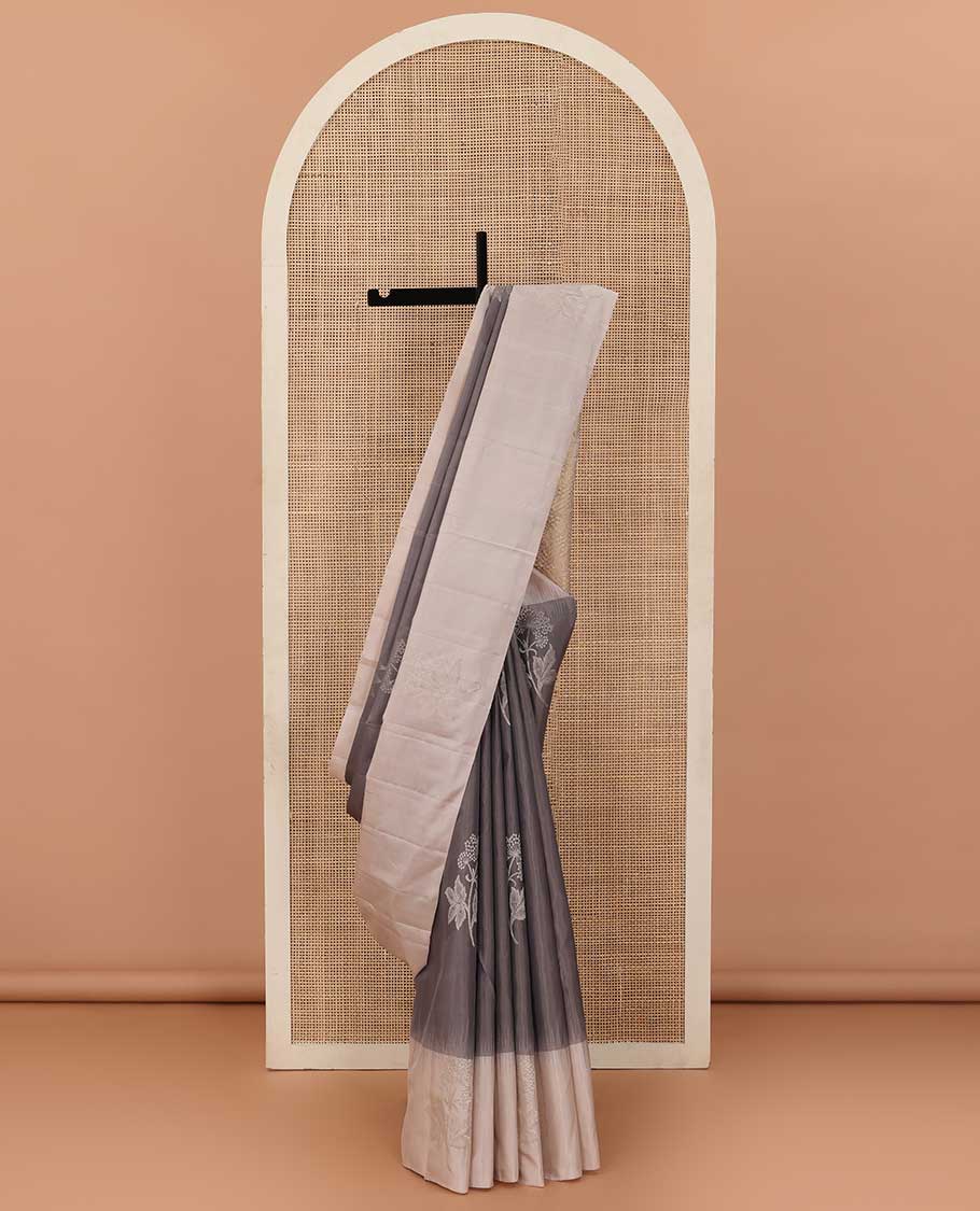 Grey floral buttas soft silk saree, contrast border of floral buttas, and jaal pallu