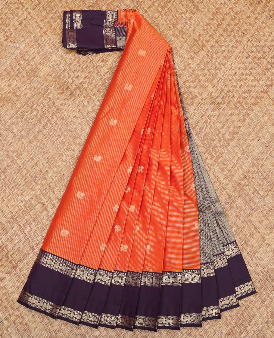 Orange Budget Silk Saree, Detailed with Peacock-Chakram Buttas and Checks, a Contrast Traditional Zari Rettai Pettu Border, Grand Pallu, and a Contrast Blouse