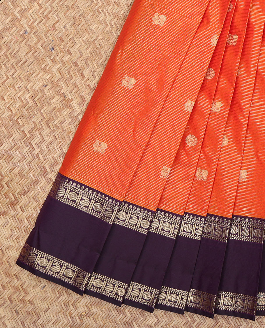 Orange Budget Silk Saree, Detailed with Peacock-Chakram Buttas and Checks, a Contrast Traditional Zari Rettai Pettu Border, Grand Pallu, and a Contrast Blouse