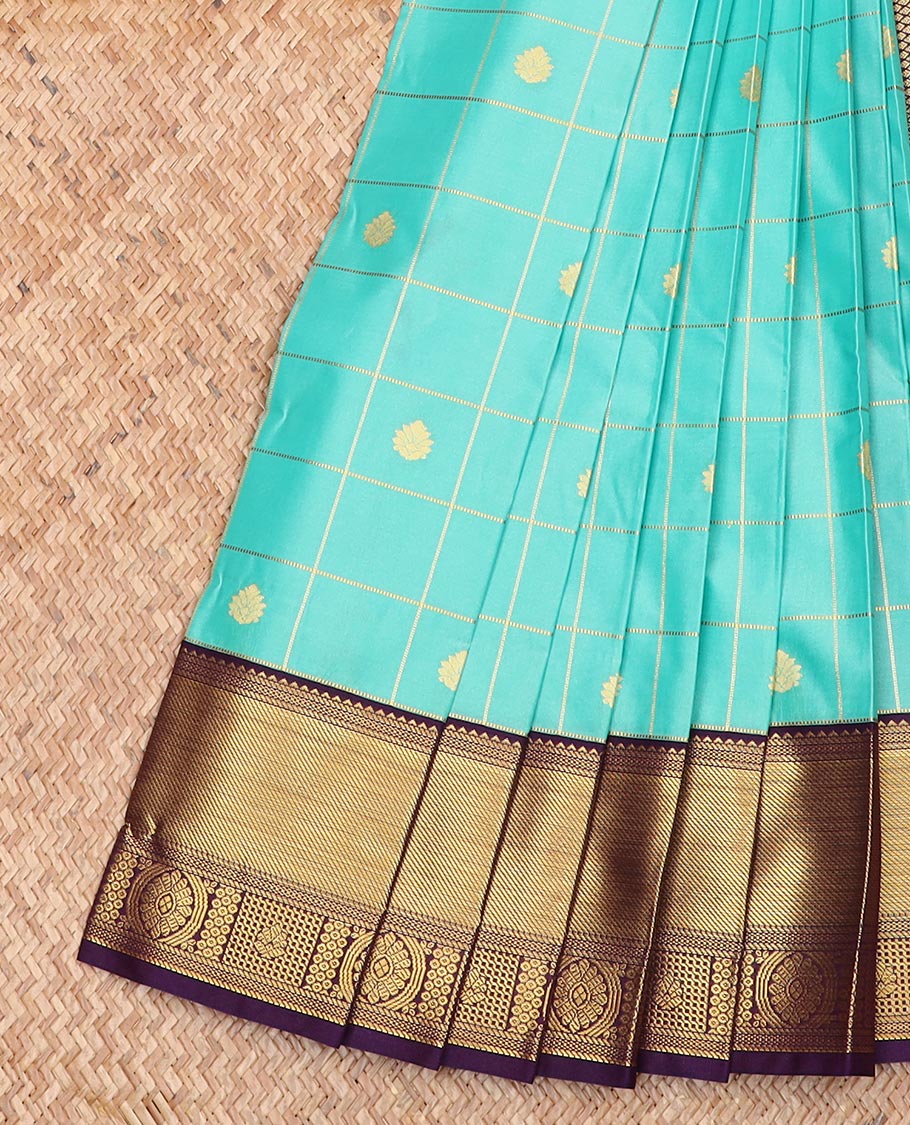 Turquoise Budget Silk Saree Enthralled with Zari Buttas Enclosed Checks, Complemented by a Contrast Traditional Design Border, Vibrant Jaal Design Pallu, and a Contrast Blouse