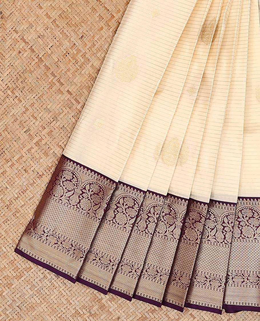 Cream zari buttas and striped gift saree, contrast traditional zari design border, and jaal pallu