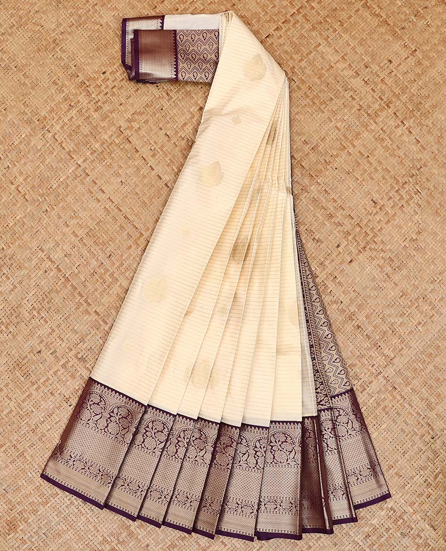 Cream zari buttas and striped gift saree, contrast traditional zari design border, and jaal pallu