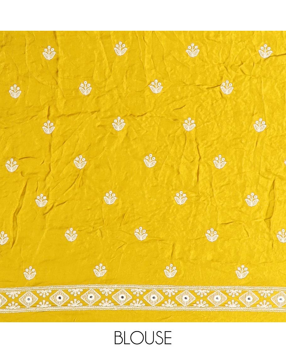 Yellow bandhani dotted bandhani silk saree, thread and mirror work border, and pallu of thread and mirror work