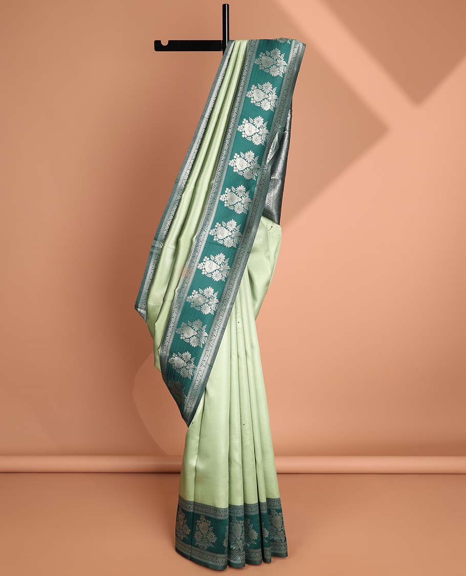 Mint green floral motifs litchi silk saree with contrast floral design border & floral jaal design pallu