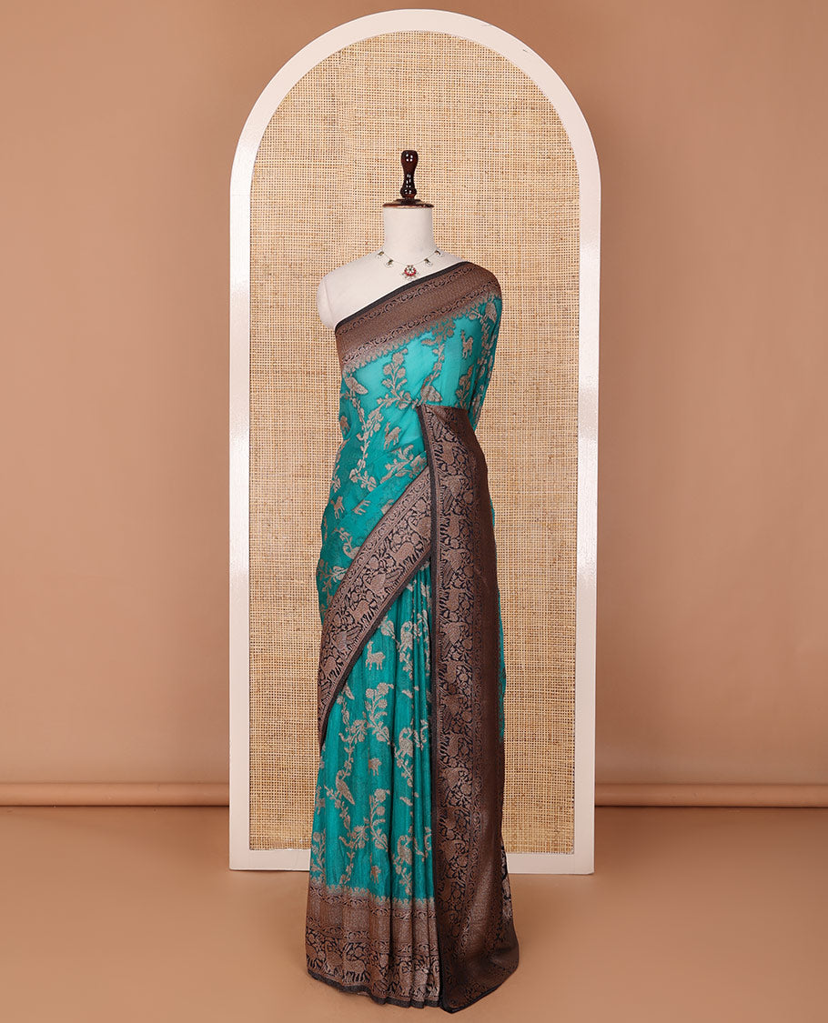 Blue floral jaal jacquard fancy crepe saree, contrast traditional zari border & flora-fauna motifs steeped pallu