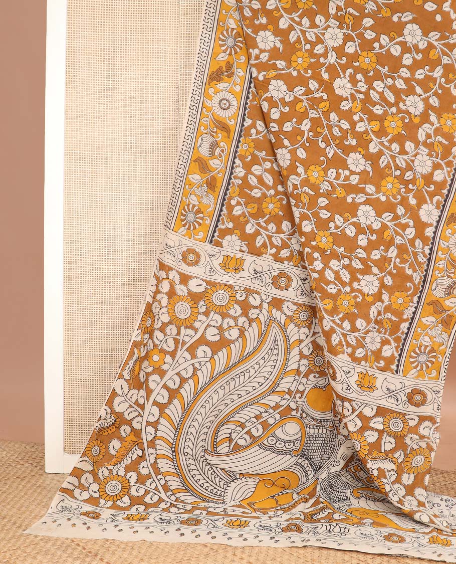 Mustard floral vine machine printed kalamkari cotton saree, contrast floral-pot motifs printed border, and pallu of peacock print