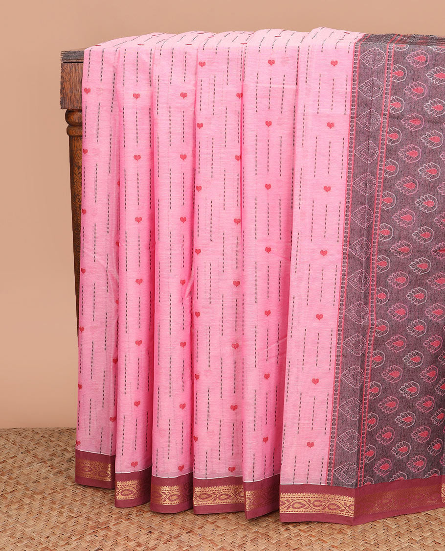 Pink dotted stripes, and heart buttas kanchi cotton saree, contrast zari border, and thilaka motifs steeped pallu