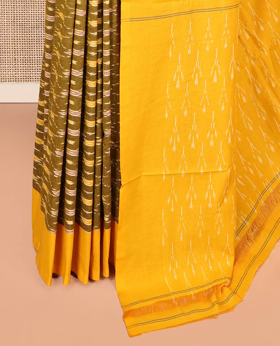Green Ikkat Cotton Saree, Adorned with Ikkat-Style Ogee Patterns on Its Body, Complemented by Contrast Plain Border, Pallu of Ikkat Designs, and Has No Blouse