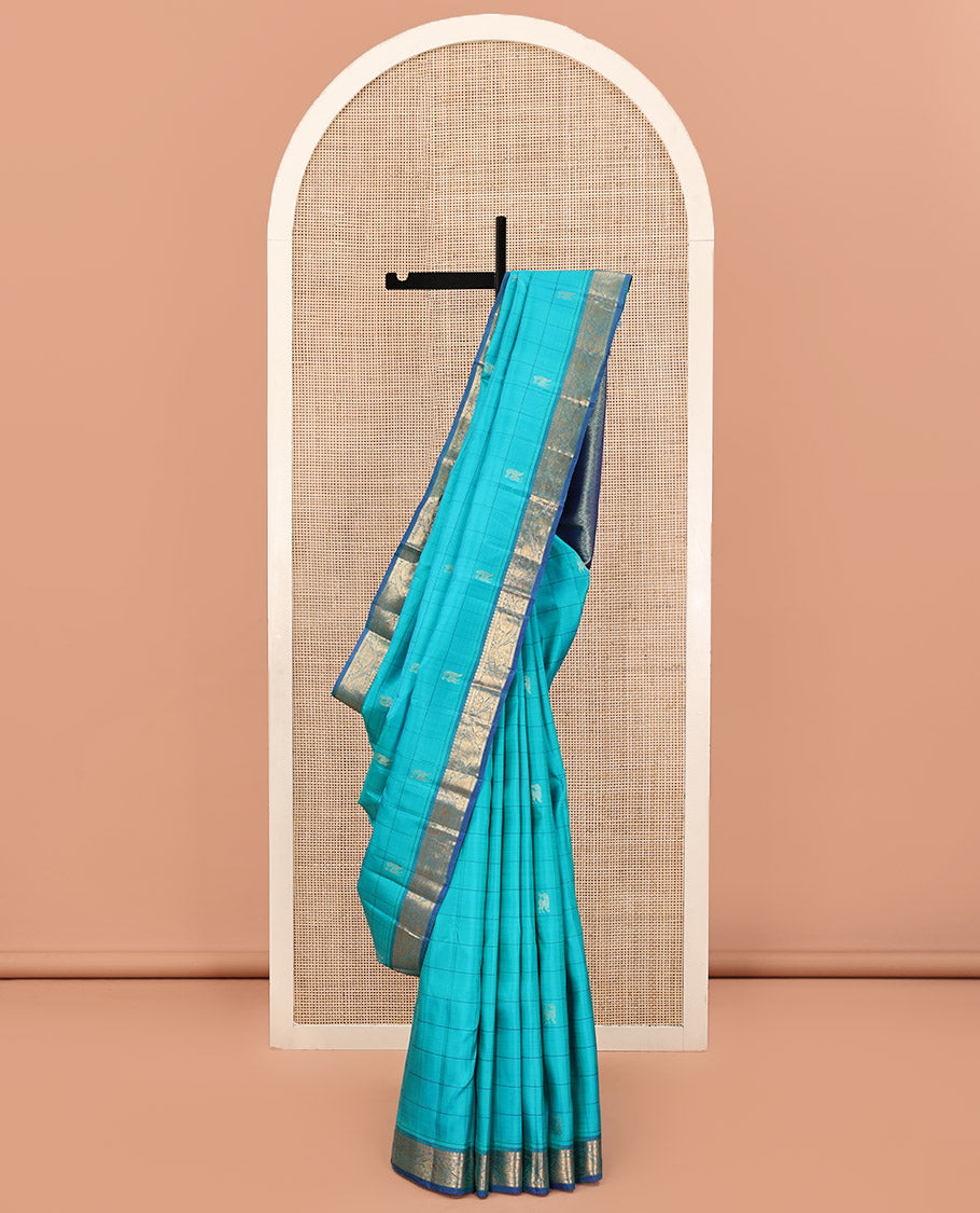 Blue Kanchipuram Silk Saree, Sparsely Sparkled with Mayil Butta Enclosed Checked All Over Its Body, Complemented by a Contrast Traditional Zari Design Border, Pallu of Jaal Designs, and Paired with a Contrast Blouse