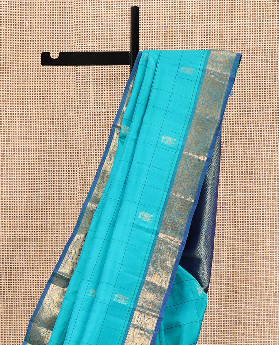 Blue Kanchipuram Silk Saree, Sparsely Sparkled with Mayil Butta Enclosed Checked All Over Its Body, Complemented by a Contrast Traditional Zari Design Border, Pallu of Jaal Designs, and Paired with a Contrast Blouse