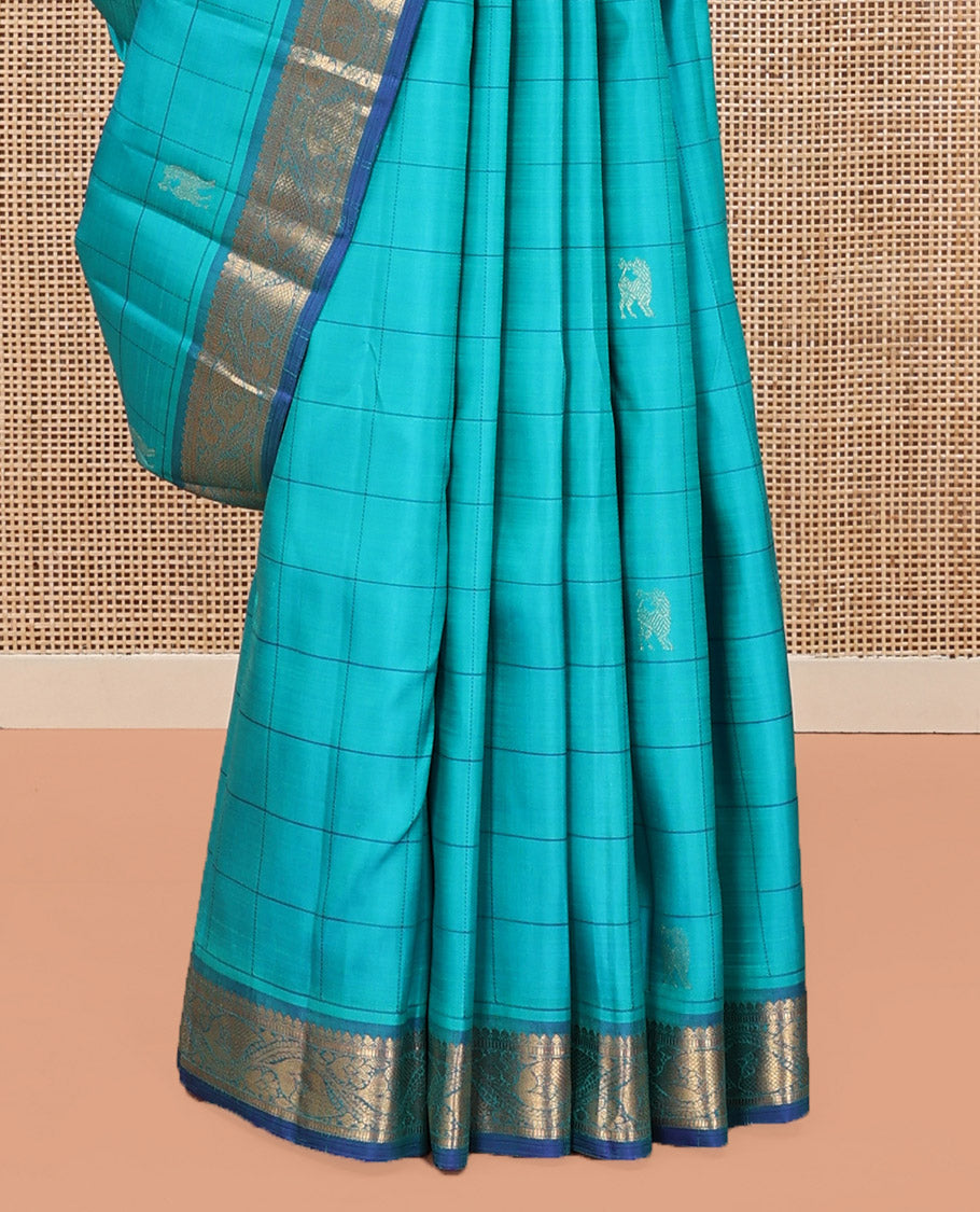 Blue Kanchipuram Silk Saree, Sparsely Sparkled with Mayil Butta Enclosed Checked All Over Its Body, Complemented by a Contrast Traditional Zari Design Border, Pallu of Jaal Designs, and Paired with a Contrast Blouse