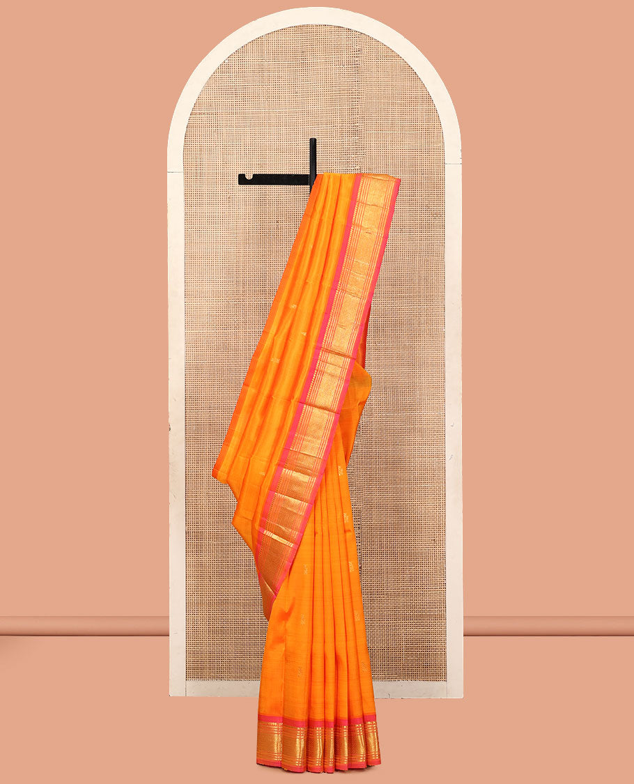 Orange Kanchipuram Silk Saree, Woven with Zari Buttas, a Contrast One-Sided Border of Banaras, Muthu, and Mayil Kann Designs, a Zari Design Pallu, and No Blouse