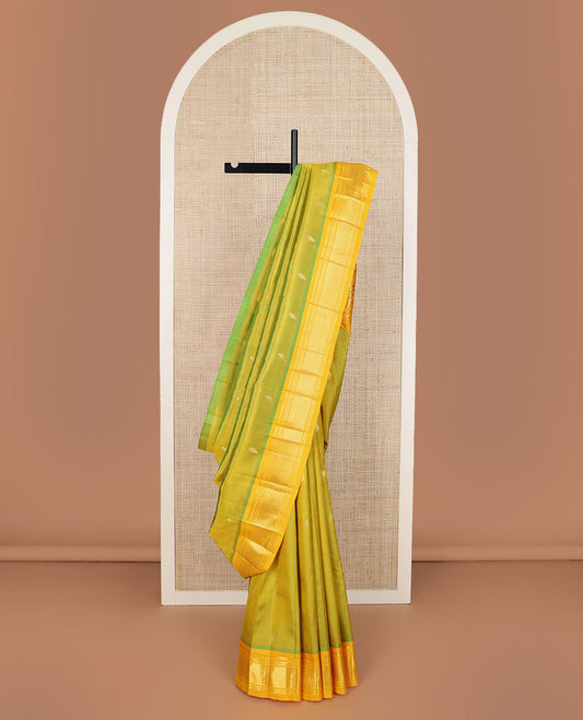 Green buttas Kanchipuram silk saree, contrast border of panner sombu, banaras & jaal design & floral design pallu