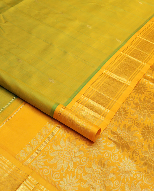 Green buttas Kanchipuram silk saree, contrast border of panner sombu, banaras & jaal design & floral design pallu