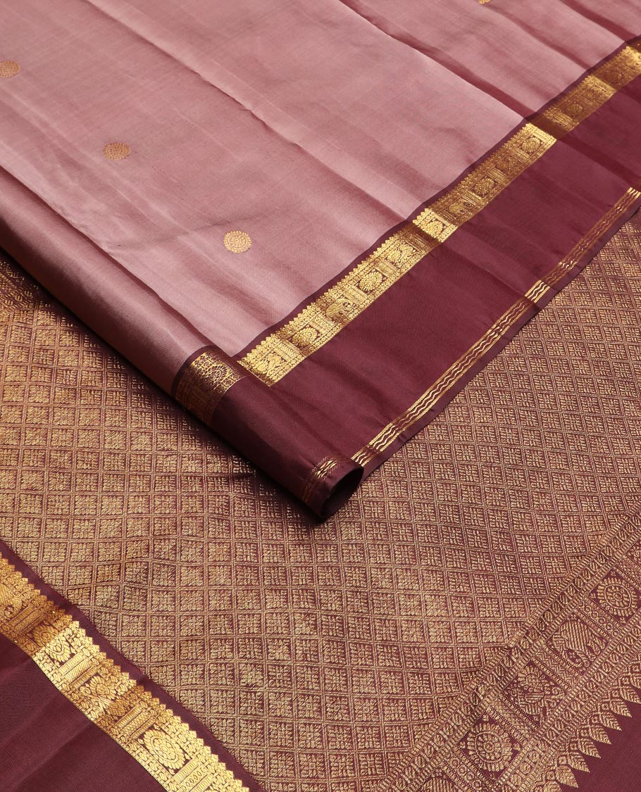 Pink annam chakram buttas Kanchipuram silk saree, contrast rettai pettu border of thilakam mokku, paisa, poo chakram and mayil designs, and jaal pallu