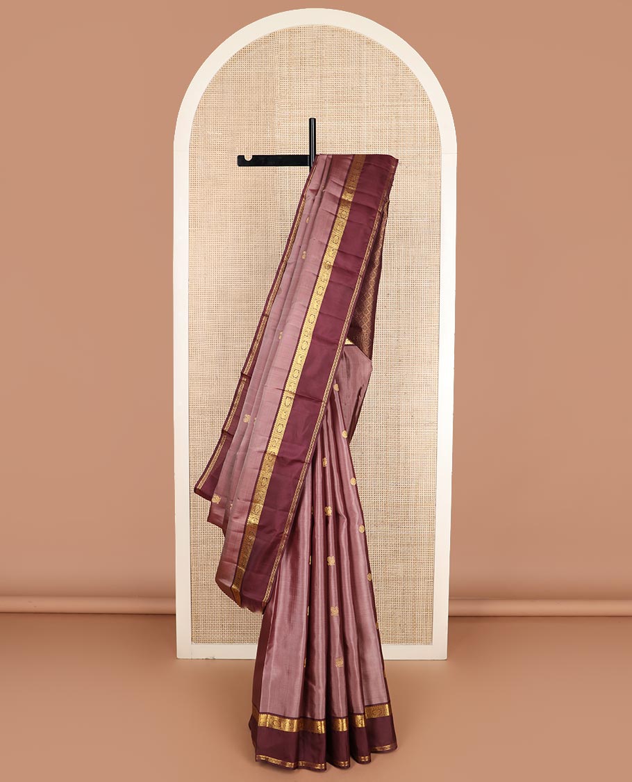 Pink annam chakram buttas Kanchipuram silk saree, contrast rettai pettu border of thilakam mokku, paisa, poo chakram and mayil designs, and jaal pallu