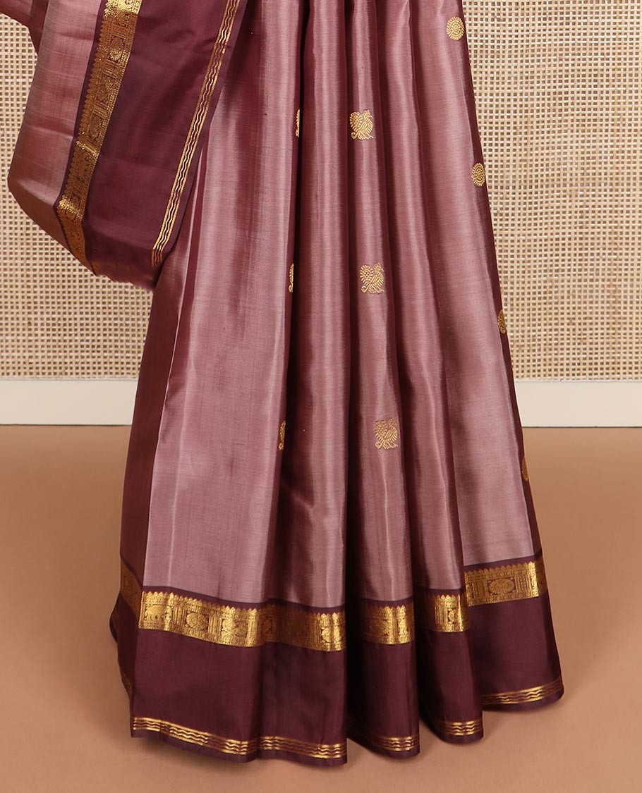 Pink annam chakram buttas Kanchipuram silk saree, contrast rettai pettu border of thilakam mokku, paisa, poo chakram and mayil designs, and jaal pallu