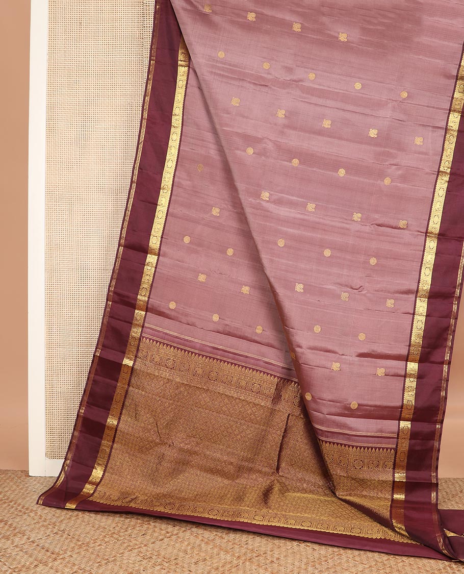 Pink annam chakram buttas Kanchipuram silk saree, contrast rettai pettu border of thilakam mokku, paisa, poo chakram and mayil designs, and jaal pallu