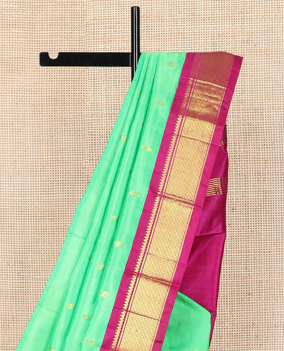 Green zari buttas Kanchipuram silk saree, contrast korvai border of thilakam mokku, banaras, and puli nagam designs, and zari design pallu