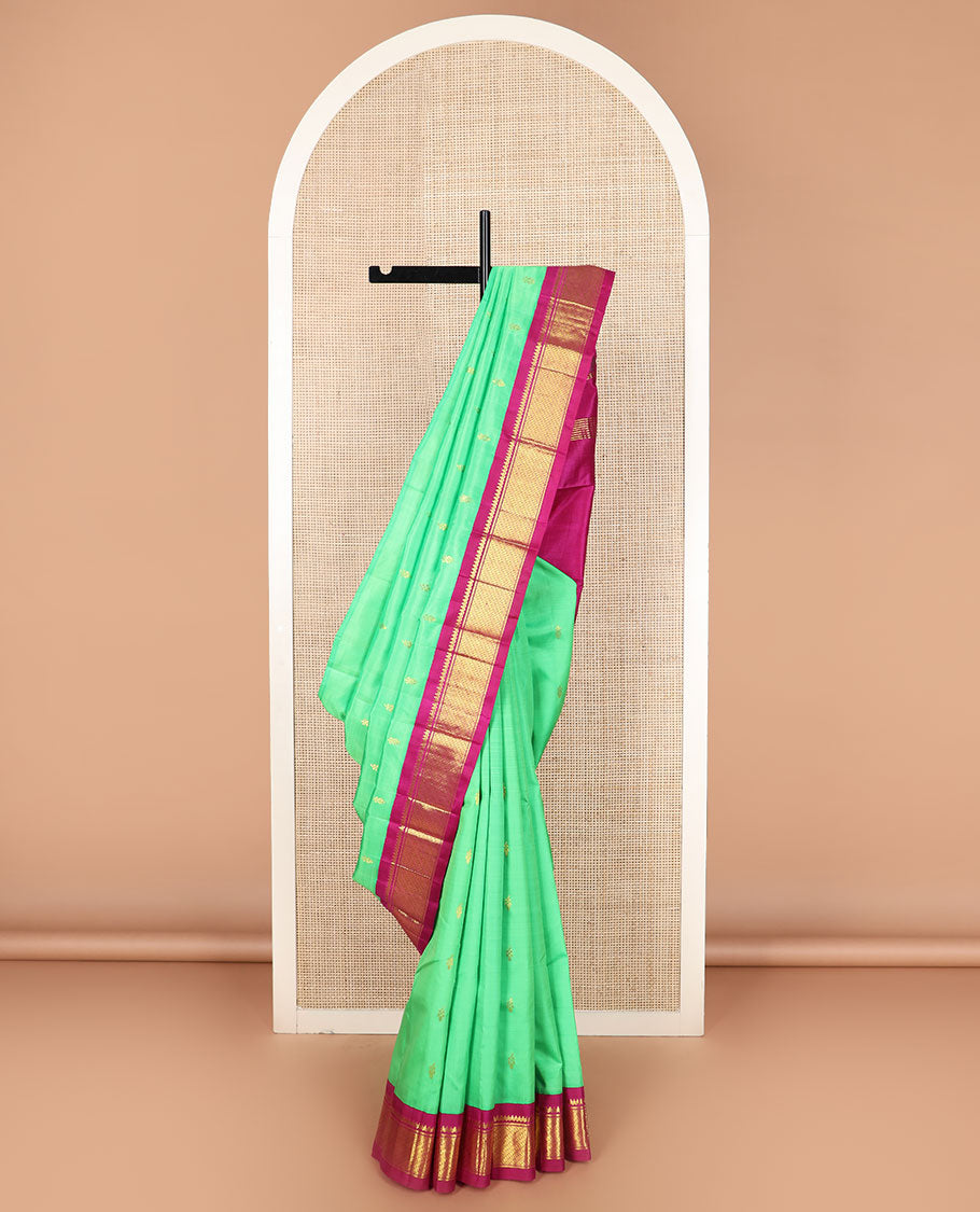 Green zari buttas Kanchipuram silk saree, contrast korvai border of thilakam mokku, banaras, and puli nagam designs, and zari design pallu