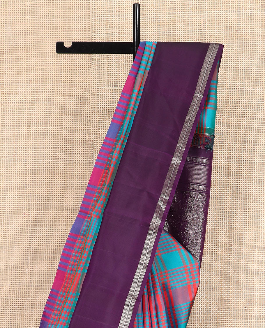 Multi-color checked Kanchipuram silk saree, contrast thazampoo rekku rettai pettu border, and vanasingaram-style flora-fauna motifs woven pallu
