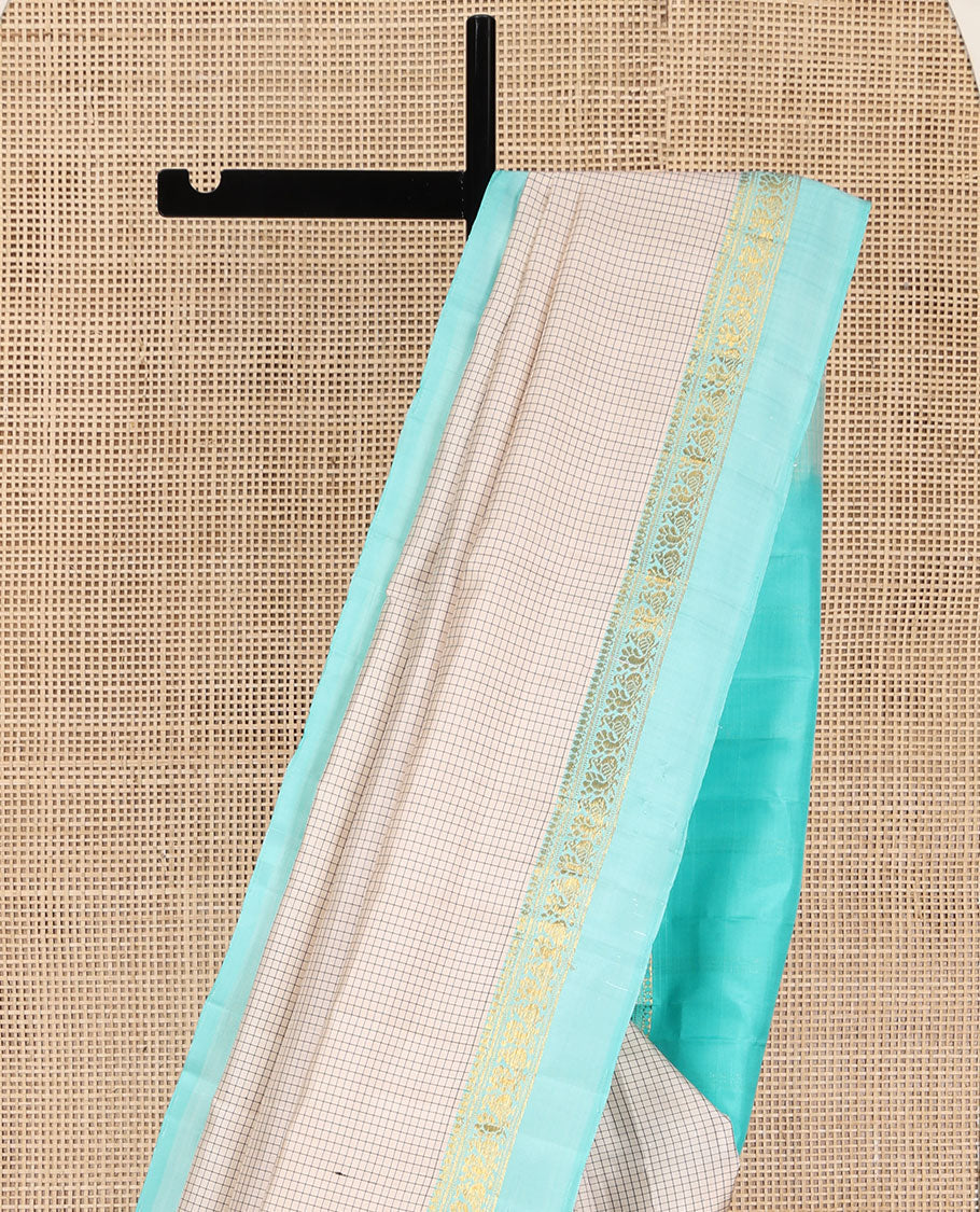 Off-White Kanchipuram Silk Saree, Accentuated with Micro-Checked Design All Over Its Body, Complemented by Contrast Kal Erangina Border of Thilakam Mokku, Banaras, Muthu, and Mayil Designs, Subtly Zari Striped Pallu, and Paired with a Contrast Blouse