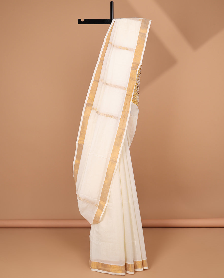Cream kerala saree with zari stripes, zari border & pallu of floral designs