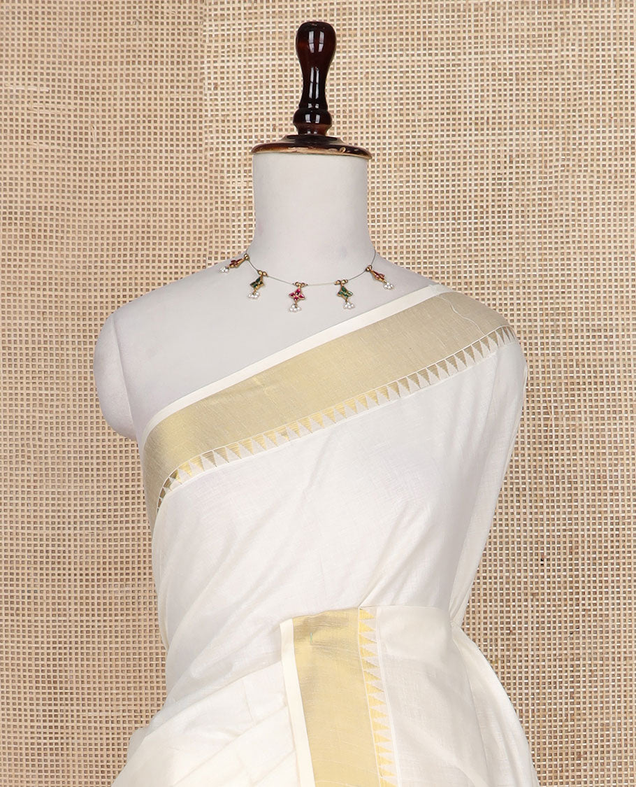 Cream temple zari design Kerala saree, zari temple border, and pallu features temple designs