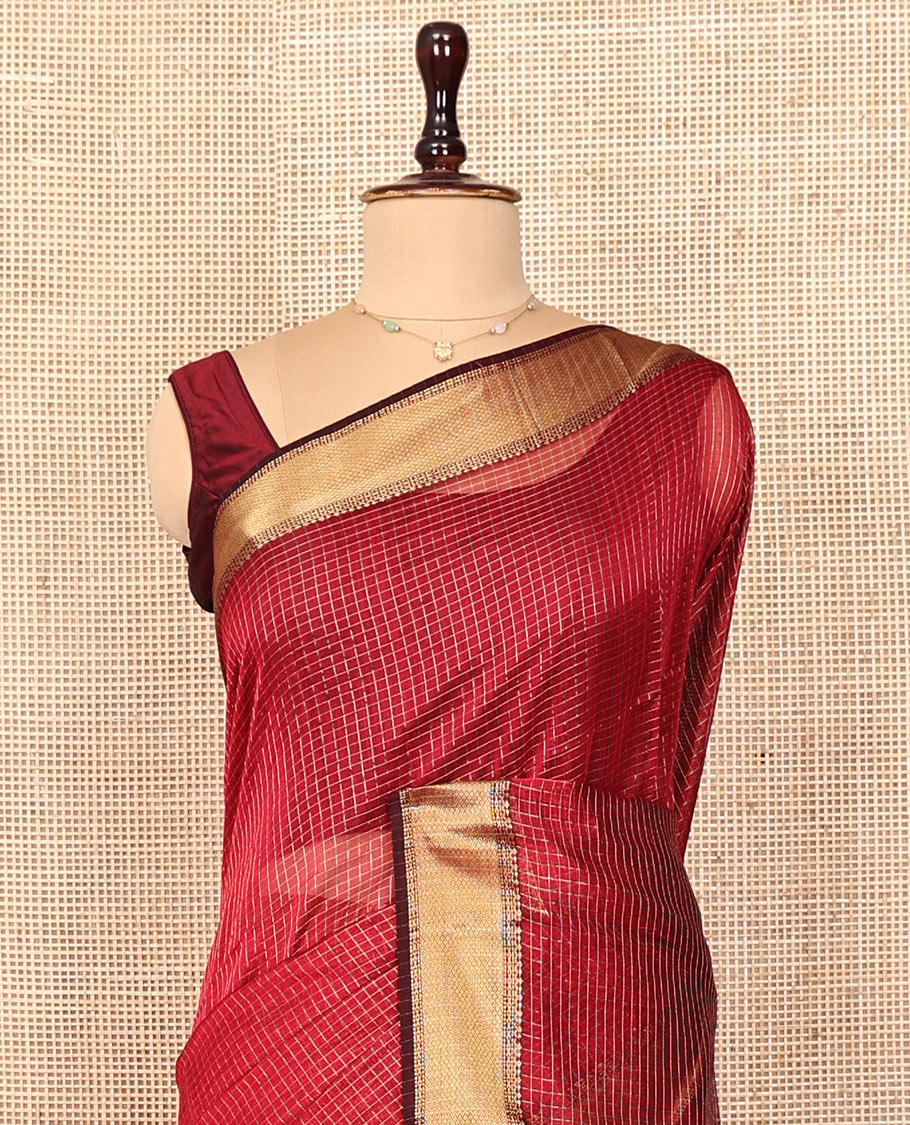 Red Maheshwari Cotton Saree, Enriched with Micro-Checked Design All Over Its Body, Highlighted by Traditional Zari Border, Pallu Steeped with Floral Designs, and Paired with a Matching Blouse