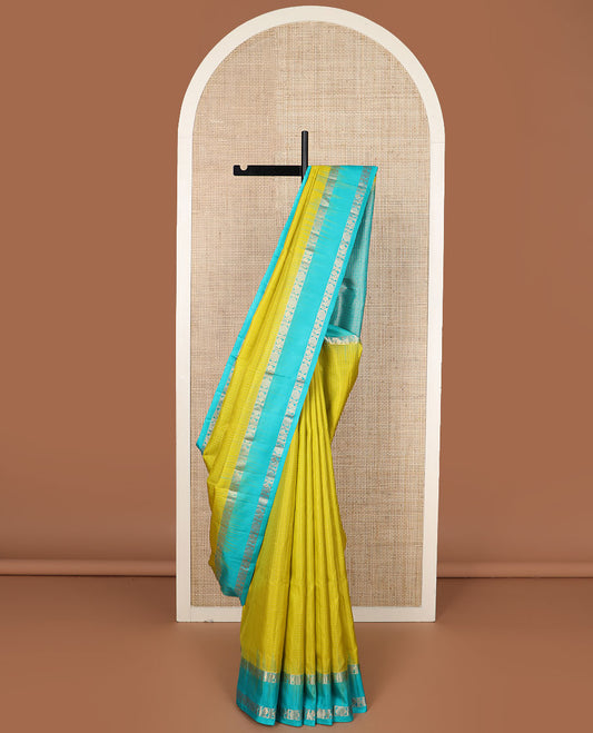 Parrot green checked soft silk saree, contrast annam chakram design rettai pettu border & ogee patterned pallu