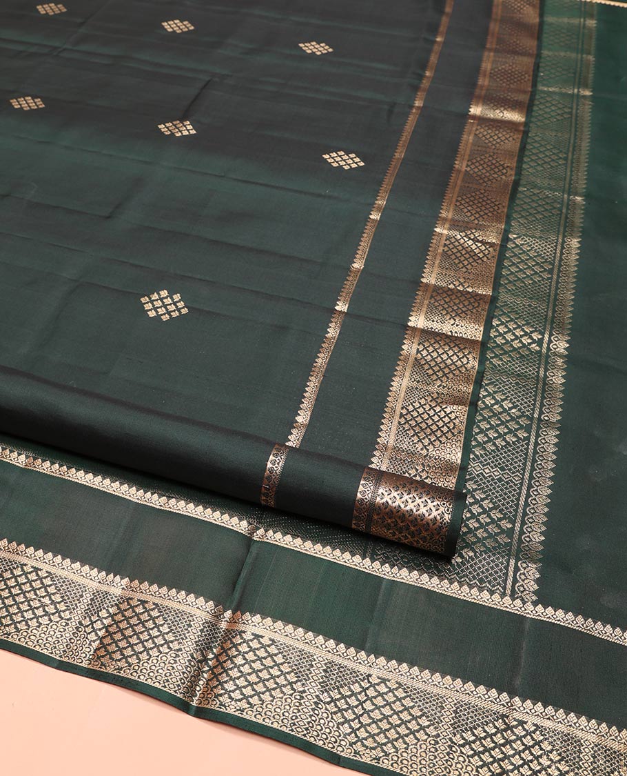 Green Mayuri Soft Silk Saree, Ornamented with Zari Buttas on Its Body, Highlighted by Zari Rettai Pettu Border of Thilakam Mokku, and Geometric Designs, Scintillating Pallu of Geometric Designs, and Paired with Matching Blouse