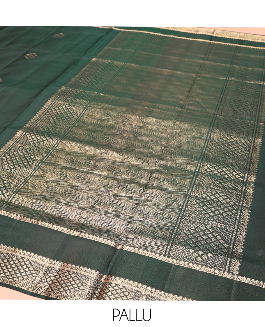Green Mayuri Soft Silk Saree, Ornamented with Zari Buttas on Its Body, Highlighted by Zari Rettai Pettu Border of Thilakam Mokku, and Geometric Designs, Scintillating Pallu of Geometric Designs, and Paired with Matching Blouse