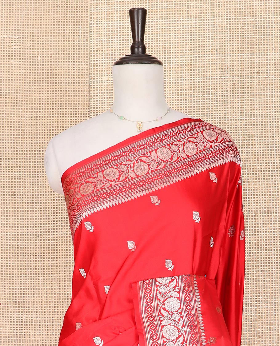 Red buttas mushru silk saree, traditional border of floral creeper designs, and zari-rich jaal pallu