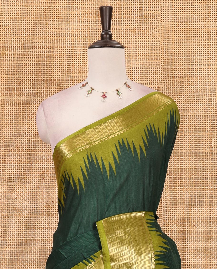 Green plain dola-tussar saree, contrast temple zari border, patola animal motifs enclosed jaal printed pallu & patola printed blouse