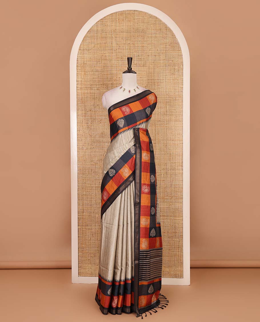 Chikku-black plain kathan silk saree, contrast buttas enclosed multi-color checked blocks border, temple pallu, and contrast blouse of checks, and buttas