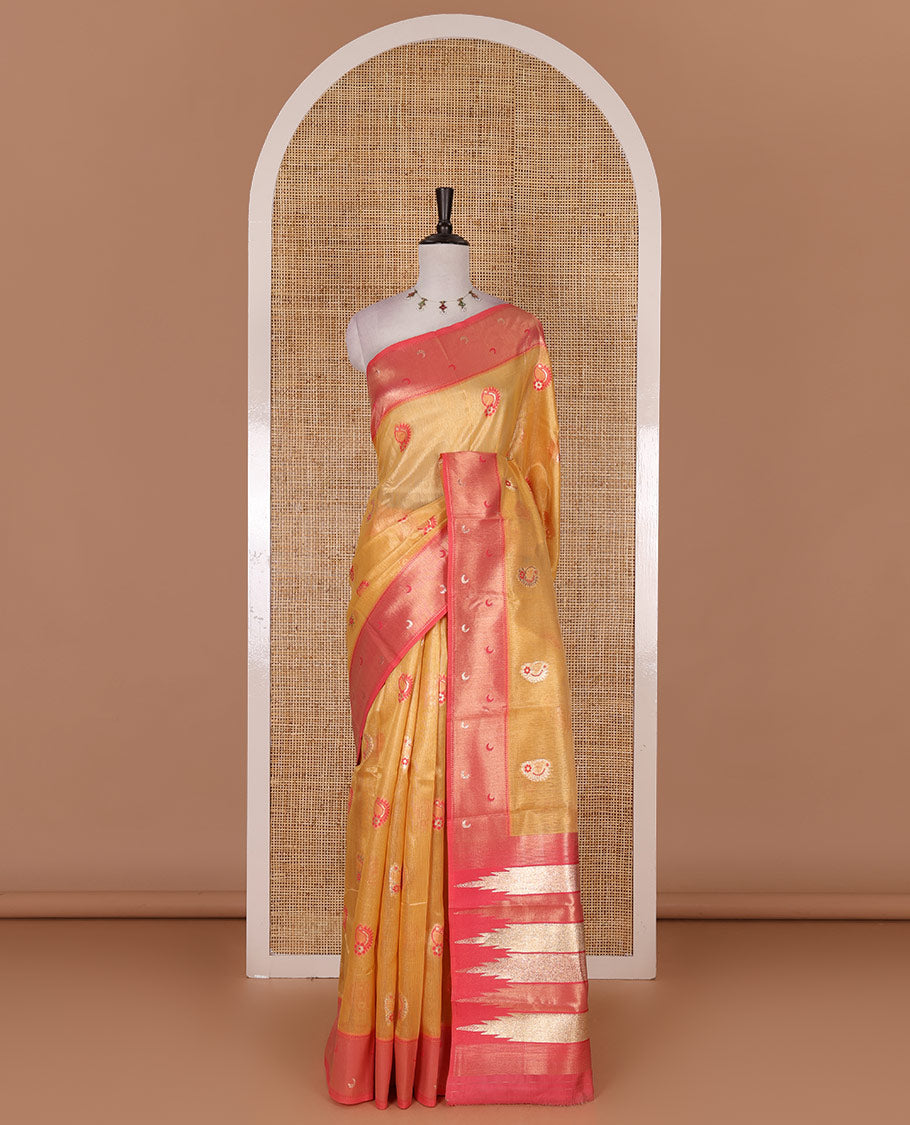 Yellow antique buttas tissue silk saree, contrast satin zari border of half-moon motifs, pallu of temple design pallu, and contrast butta blouse