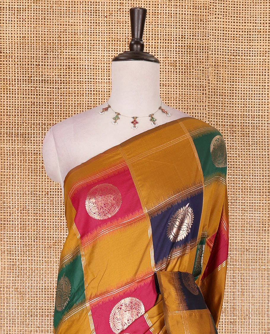 Borderless mustard chakra buttas enclosed, checked elite soft silk saree, contrast ogee patterned pallu, and contrast zari design blouse