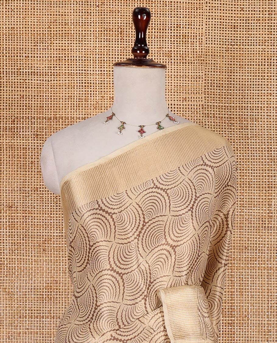 Chikku scallop design tissue saree, zari striped border, striped pallu, and gleaming matching blouse