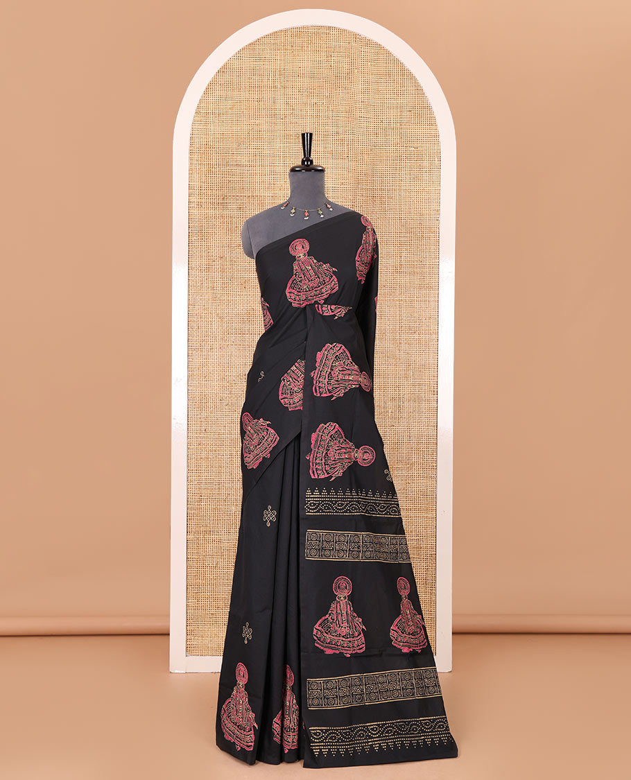 Borderless black kolam and kathakali motifs printed South cotton saree with a matching blouse, and a contrast floral-peacock vine printed blouse