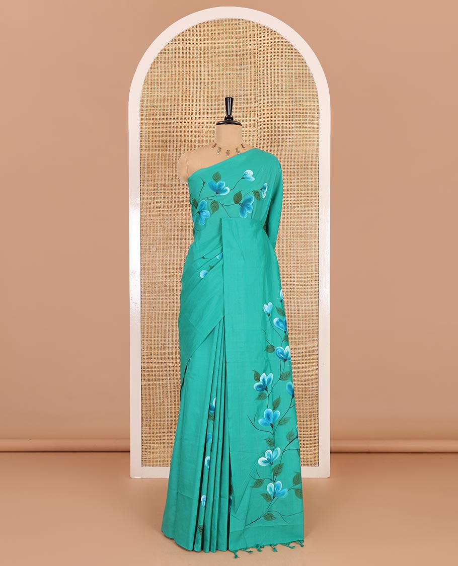 Borderless peacock green floral vine hand painting style placement printed South cotton saree and a matching floral printed blouse