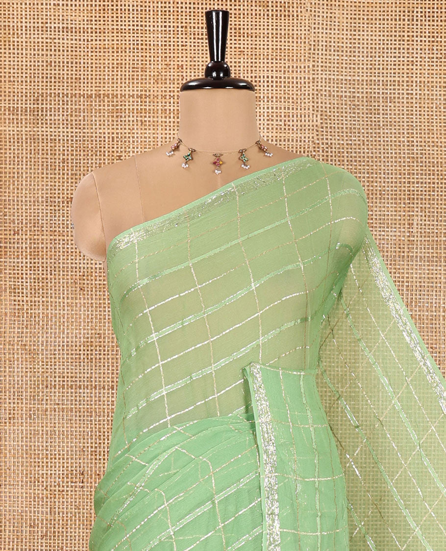 Green Chinon Chiffon Saree, Prettified with Gold Zari Checked Design on Its Body, Self-Pallu, and Paired with a Contrast Elephant-Tree-Themed French Knot Embroidered Blouse