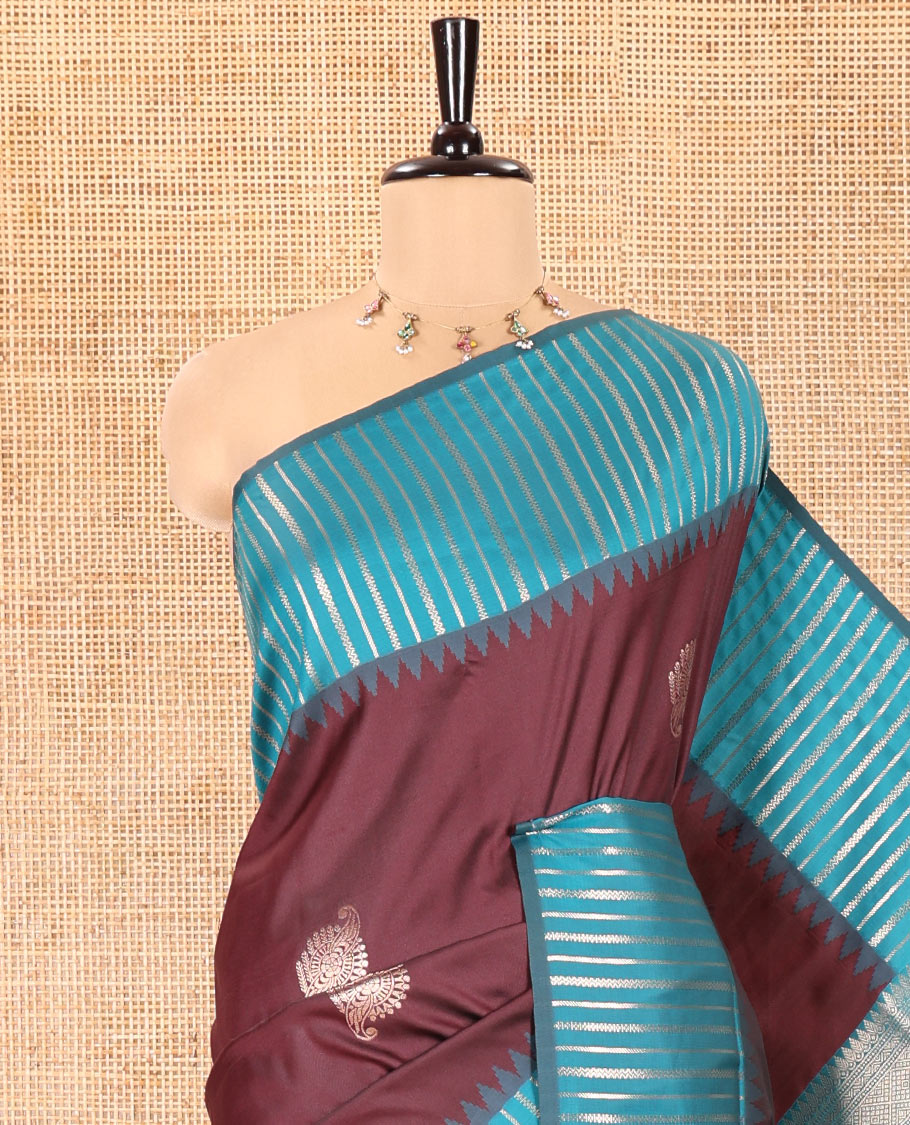 Wine Elite Soft Silk Saree, Elevated with Zari Buttas All Over Its Body, Complemented by Contrast Border Steeped with Geometric Patterns, Grand Pallu, and Paired with a Contrast Blouse