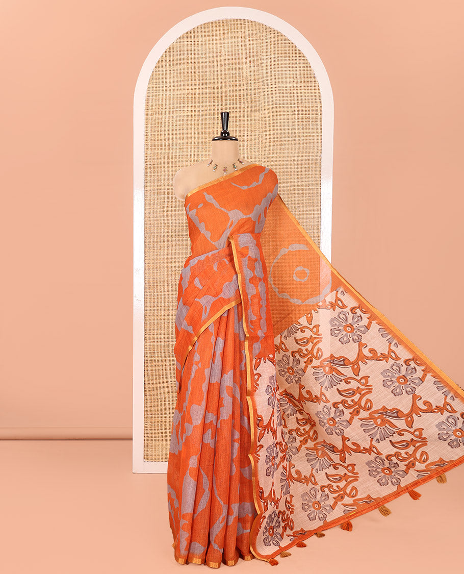 Orange Linen Cotton Saree, Enthralled with Shibori Printed on Its Body, Subtle Piping Border, Pallu of Floral Vine Print, and Paired with a Contrast Floral Vine Printed Blouse