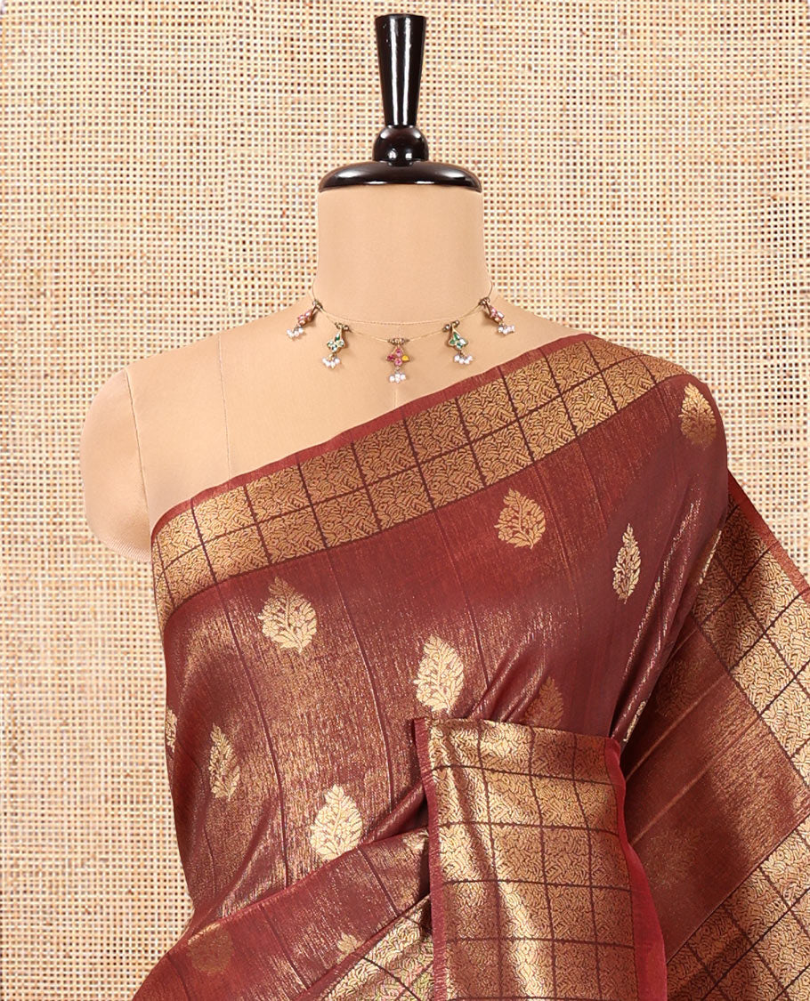 Brown Kanchi Silk Saree, Mesmerized with Zari Buttas All Over Its Body, Highlighted by Zari Checked Border, a Grandly Decked Up Pallu, and Paired with a Chevron Jacquard Blouse