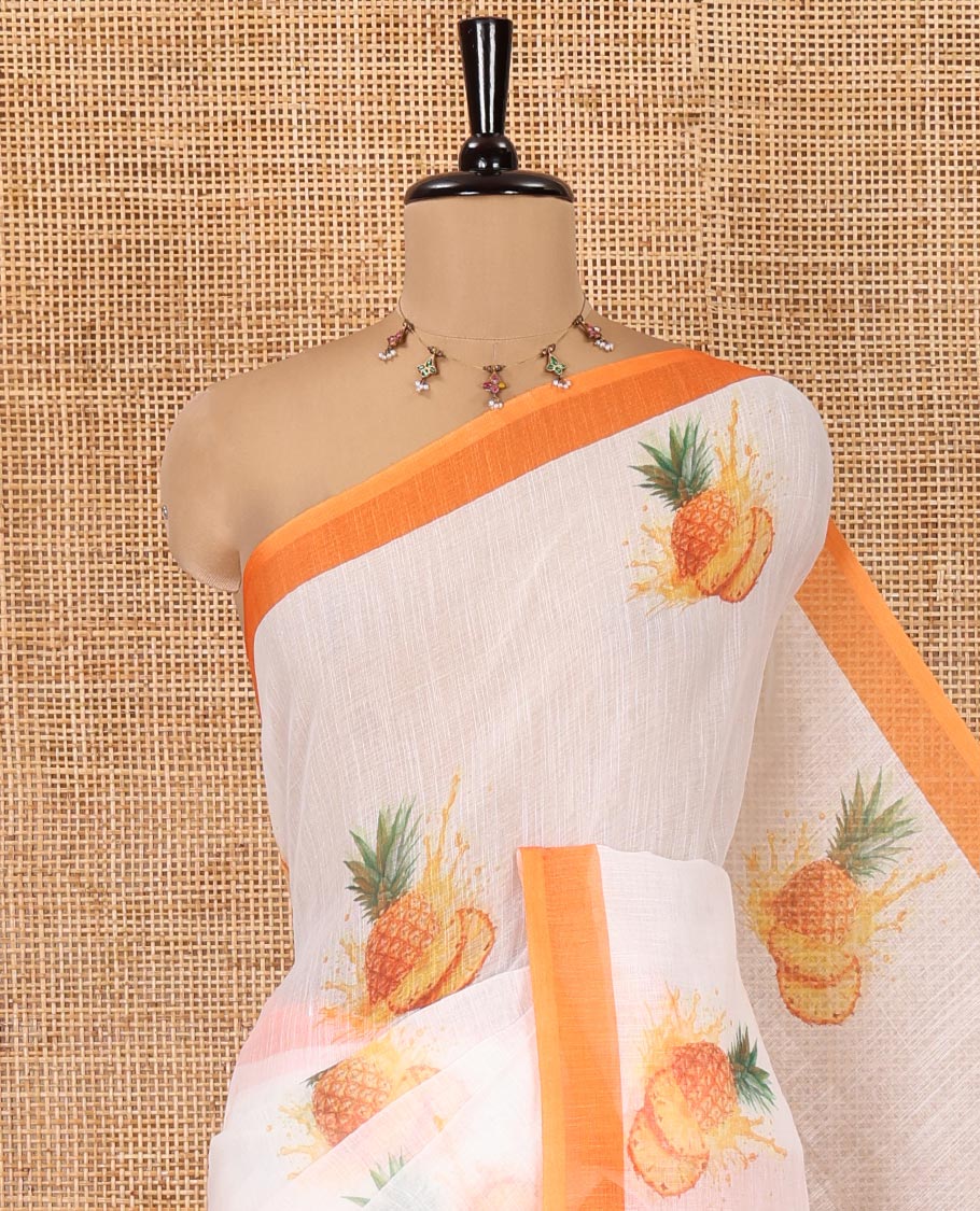 White Linen Cotton Saree, Artfully Printed with Pineapple Motifs All Over Its Body, Complemented by a Contrast Border, Geometric -Printed Pallu, and Paired with a Contrast Blouse
