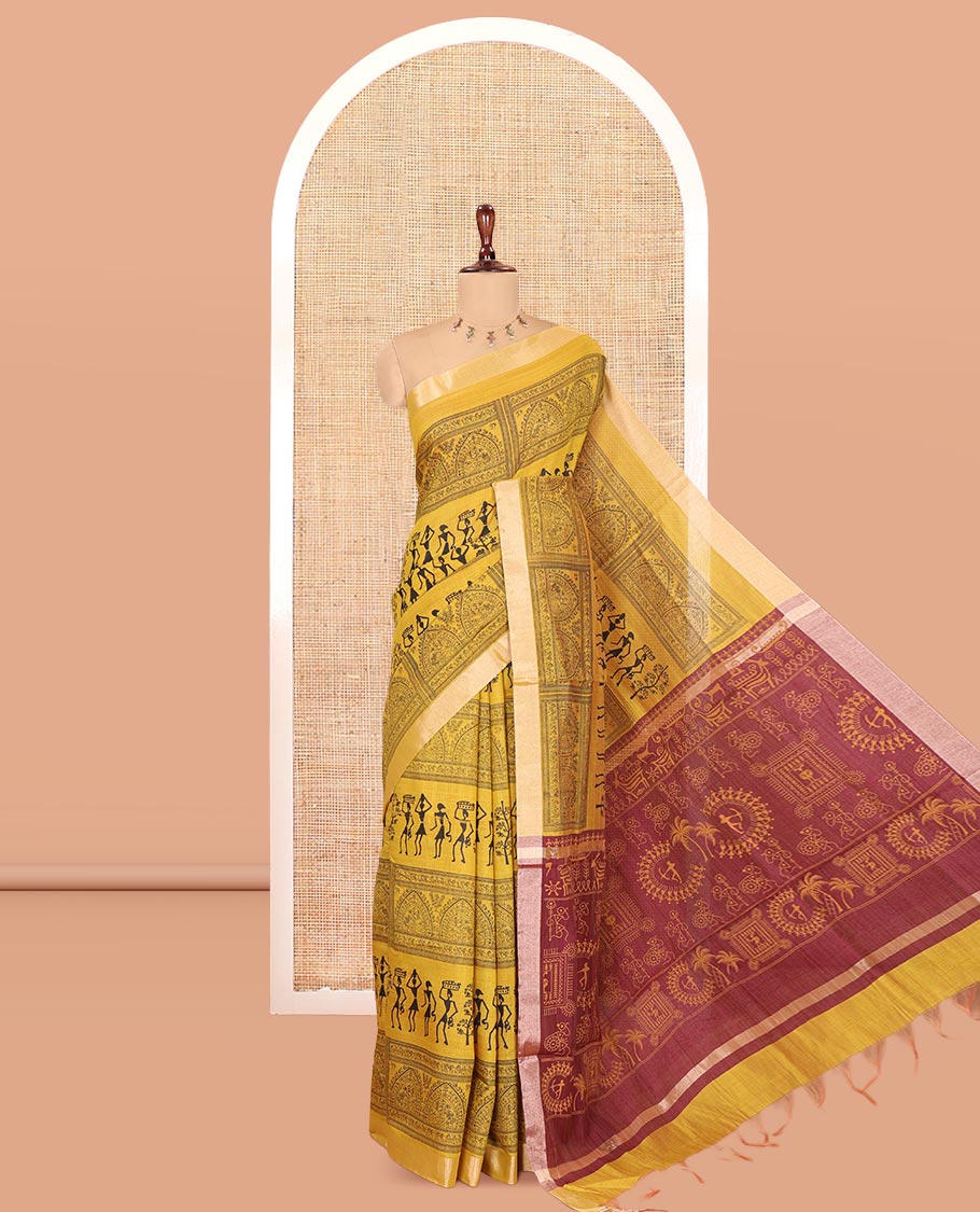 Yellow Semi-Silk Cotton Saree, Adorned with Warli Print, a Tissue Border, Contrast Warli Printed Pallu, and a Contrast Blouse